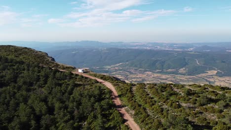 Ager,-Lerida,-Catalonia,-North-Spain---Aerial-Drone-View-at-the-top-of-a-Mountain-Range-with-Beautiful-View-at-the-Valley---This-is-Ultimate-Adventure-and-Freedom