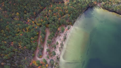 Birds-Eye-Aerial-View-of-White-Lake,-New-Hampshire-USA,-Lakefront-and-Forest-of-State-Park-at-Fall-Season,-Drone-Shot