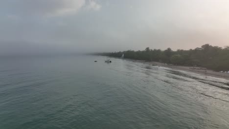 Aerial-View,-Misty-Summer-Morning-and-Person-Running-on-Sandy-Beach-by-Caribbean-Sea