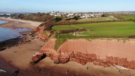 Aerial-panning-right-shot-of-Jurassic-Cliffs-at-Orcombe-Point-Exmouth-Devon-England