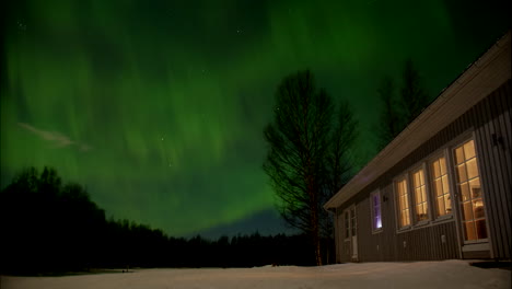 Green-Aurora-Borealis-Polar-lights-above-house-in-Northern-Europe,-Time-lapse