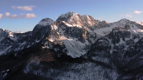 AERIAL---Epic-view-of-a-beautiful-snowy-mountain-winter,-Kolasin,-Montenegro,-forward