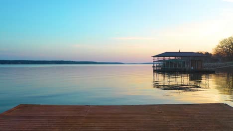 Wooden-Floating-Dock-With-Metal-Ladder-On-Tranquil-Lake-At-Sunrise-Along-The-Shore-Of-Grand-Lake-In-Oklahoma