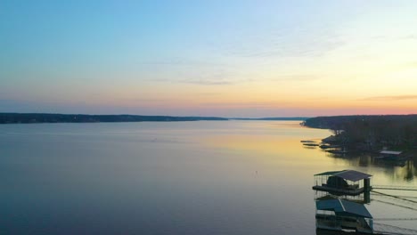 Drone-View-of-Floating-Docks-for-Fishing-At-Grand-Lake-in-Midwest-Oklahoma-During-Beautiful-Calm-Sunset---aerial-drone-shot