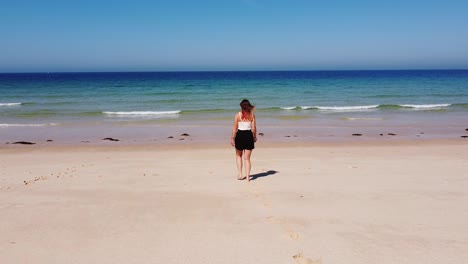 Tourist-Girl-Walking-at-the-Comporta-Beach,-Alentejo,-West-Coast-of-Portugal