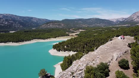 Aerial-Drone-View-of-Viewpoint-Mirador-Peña-Quesada-in-National-Park-Sierra-Cazorla,-Segura-y-Villas,-Jaen,-Andalusia,-Spain---Fly-over-the-Blue-Lake-and-Water-Reservoir