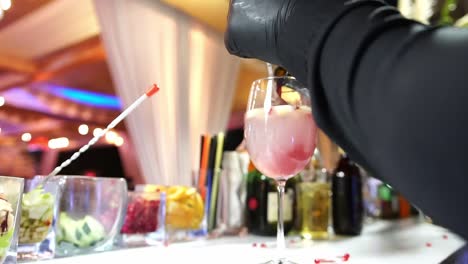 A-barman-preparing-a-sangria-drink-on-a-glass