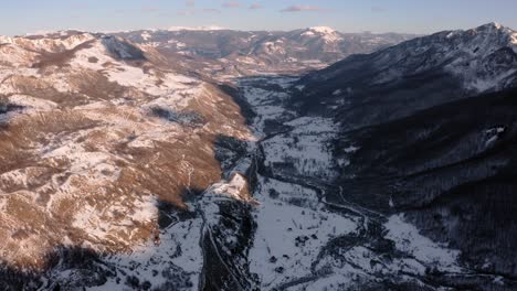 AERIAL---Beautiful-snowy-winter-in-the-mountains,-Kolasin,-Montenegro,-reverse-tilt-up