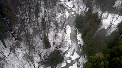 Winter-Forest-and-River-Aerial-Fly-over