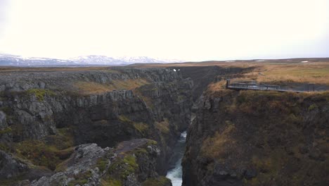 Lookout-platform-above-the-rocky-Kolugljufur-waterfall-canyon,-Iceland