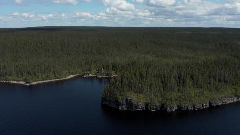 Aerial-shot-over-a-vast-lake-and-forest