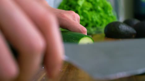 Cutting-The-Tip-Of-A-Green-Organic-Cucumber