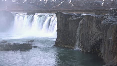 Rock-cliffs-and-lake-of-the-roaring-Godafoss-waterfall-in-Iceland