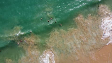 Perfect-Birds-Eye-Shot-Of-Long-Wave-Coming-Slowly-Fading-On-Sandy-Beach