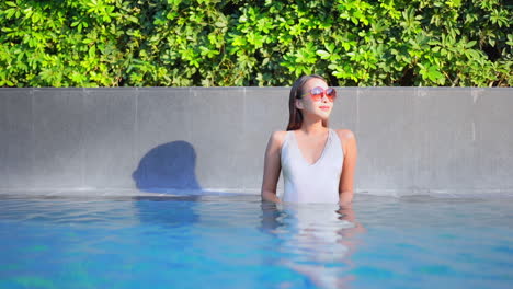 A-young-attractive-woman-stands-in-a-swimming-pool