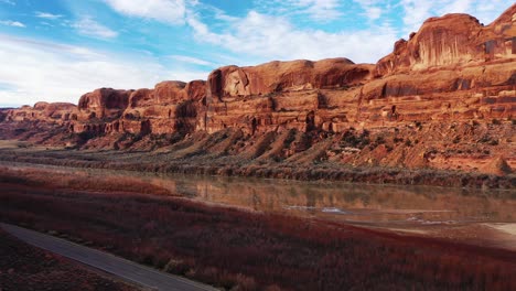 Panorama-of-picturesque-famous-grand-canyon-of-Colorado-river-with-red-sandstone-rocks-in-light-of-sunset