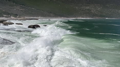 Huge-Foamy-Waves-Breaking-On-The-Shore-At-Sandy-Bay-Beach,-Cape-Town,-South-Africa---slow-motion