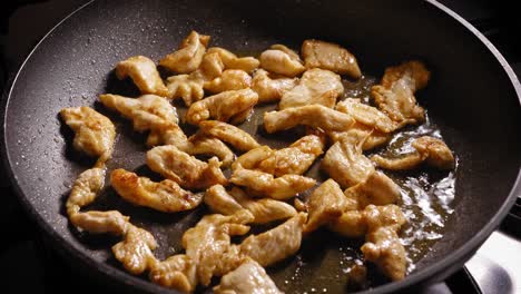 Pieces-of-Chicken-Breast-are-Simmering-on-Frying-Pan,-Making-Noodles-Dish