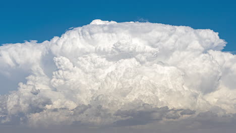 Close-up-time-lapse-of-a-large-Cumulonimbus-cloud-growing-and-transforming-into-an-Anvil-cloud