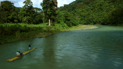Drone-shot-of-rafting-on-the-Rio-Grande-River-in-Portland,-Jamaica