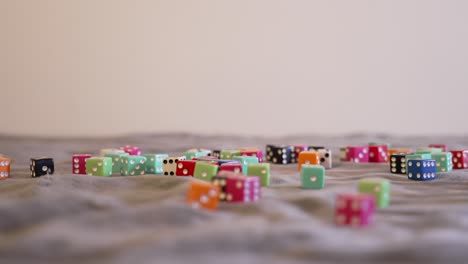 Rolling-blue-dice-onto-a-pile-in-extreme-slow-motion