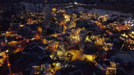 Aerial-shot-of-city-in-Cappadocia-during-night,-many-lights-of-the-houses