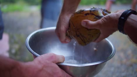 Coconut-Water-Fresh-Pouring-into-Bowl-Outdoors-in-Costa-Rica-After-Opening-Coconut