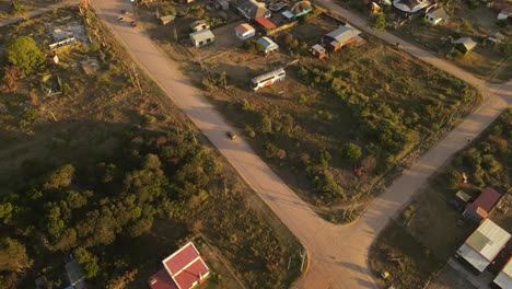 Car-driving-on-road-in-small-village-at-Punta-del-Diablo-in-Uruguay