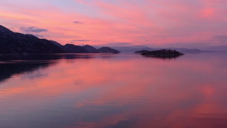 Beautiful-nature-landscape-of-orange-sunset-reflecting-in-water