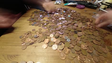 Couple-budgeting-counting-coins-time-lapse-financial-savings-planning-expenses