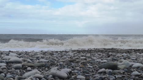 February-2022-storm-Eunice-crashing-waves-on-Welsh-stone-pebble-beach