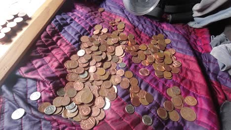 Male-counting-and-stacking-coins-time-lapse-financial-savings-money-budgeting