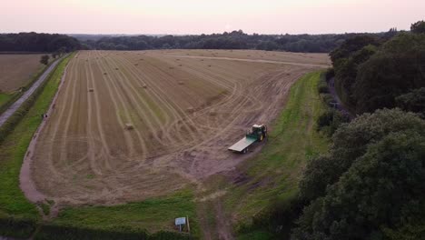 Drone-shot-of-tractor-on-field-amber-lights-flashing