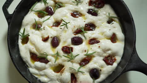 Italian-Focaccia-being-made-in-a-cast-iron-pan