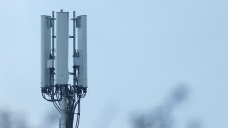Cellular-telecommunication-transmission-tower-on-gloomy-overcast-morning-static-shot