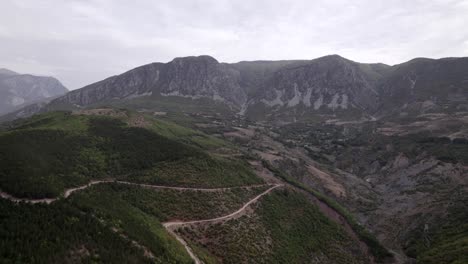Drone-video,-of-a-diagonal-slider-plane-over-a-valley-in-Kukes-County,-Albania