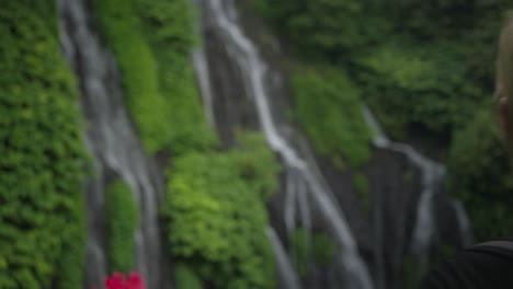 Blond-female-hiker-arriving-at-Banyumala-Twin-Waterfalls-in-tropical-Bali