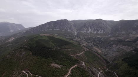 Drone-video,-frontal-plane-advancing-over-a-valley-in-Kukes-County,-Albania