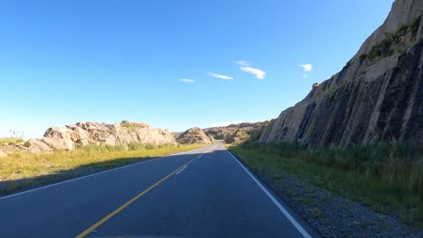 Pov-shot-at-drive-on-Altas-Cumbres-Route-in-Cordoba-during-sunny-day-in-Argentina