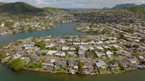 Flyover-gorgeous-homes-in-Kailua-neighborhood-of-Oahu-Hawaii-on-a-beautiful-sunny-day