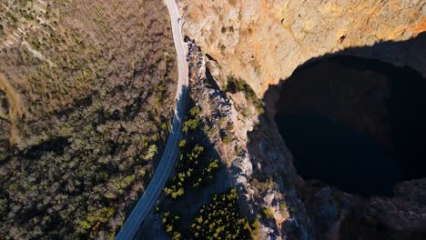 A-fly-by-on-the-edge-of-Red-Lake-the-biggest-sinkhole-in-Europe