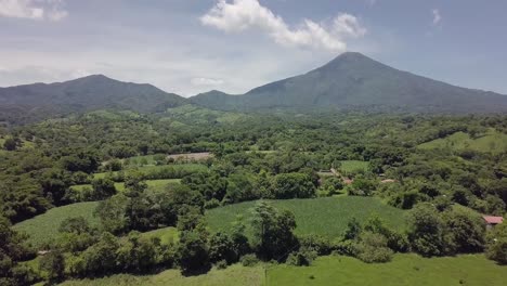 The-Chinchontepec-volcano-in-the-background-of-farmland-in-the-La-Paz-department-in-El-Salvador,-Central-America---Dolly-In