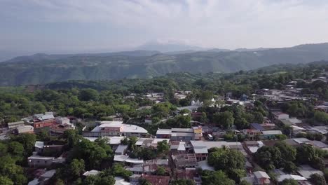 Aerial-view-of-the-small-town-of-Cuisnahuat-in-El-Salvador,-Central-America---Dolly-In
