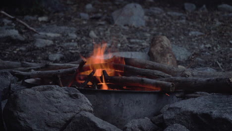 Wild-camping-bonfire-campfire-in-remote-rural-trekking-travel-natural-park-destination,-outdoor-survival-experiences