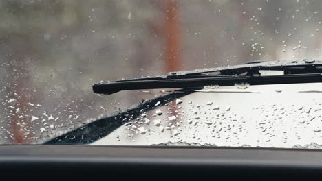 Windshield-Wiper-Seen-From-Inside-Land-Rover-Defender-D90-Off-Roading-Through-Snowy-Pine-Tree-Forest-Woods