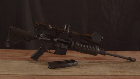 Dolly-out-of-unloaded-AR-15-rifle-with-a-magazine-in-the-foreground