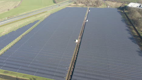 Aerial-overview-of-large-solar-panel-field-on-a-bright-sunny-day