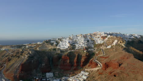 Aerial:-Heading-straight-to-Oia-inSantorini,-Greece-during-golden-hour,-4K-prores
