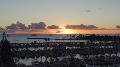 Sunset-over-boats-in-Ala-Wai-Boat-Harbor-in-Honolulu,-Hawaii-on-Oahu-island