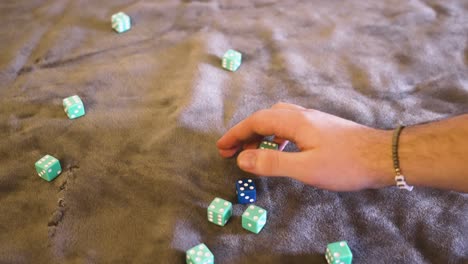 Point-of-view,-various-blue-dice-being-rolled